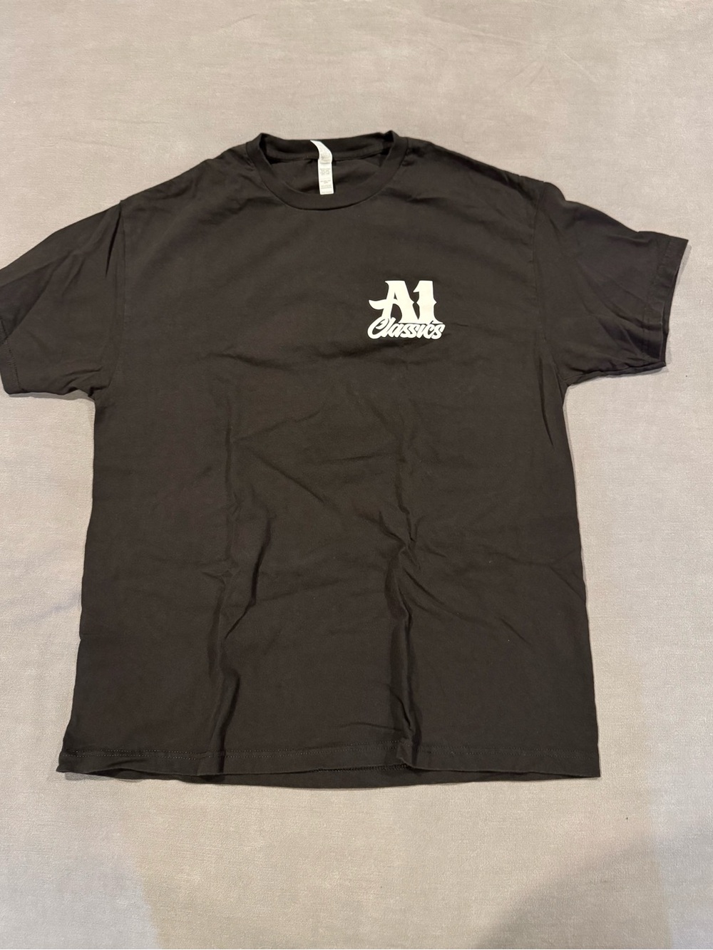 A1 Classics. Black Tee with White Chest Logo